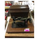 Antique sewing machine in cabinet