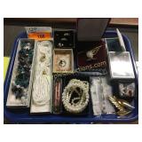 Tray full of jewelry
