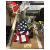 Flag, cow bell, crock