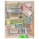 Foreign notes in plastic covers