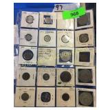 Foreign coins in plastic sheet