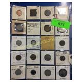 Foreign coins in plastic sheet