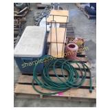 Coleman cooler, hose, rope, shelf