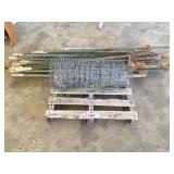 Metal post, roll of fencing