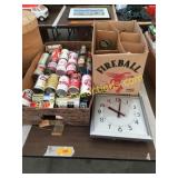 Old beer cans, wall clock, oil lamps
