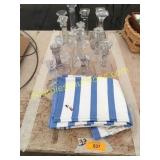 Glass candleholders, dish towels