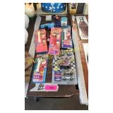 PEZ dispensers, toy race cars, misc