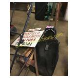"FOR SALE" sign, lawnmower bag, axes, misc