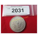 Uncirculated 1884 0Morgan silver dollar.