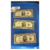 Two 1963 red seal $2 bills, One 1953 blue seal $5