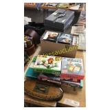 Box of DVDs, stack of games