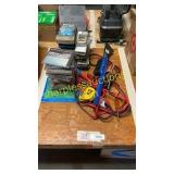 CDs, jumper cables, tools