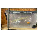 Plastic tote on wheels and handle