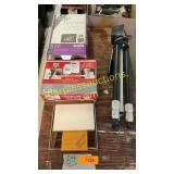 Tripod, engraved paper holder, alarm system