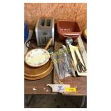 Silverware, wooden plates, toaster, utensils