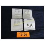 4 Vintage mother of pearl crosses.