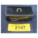 Early trinket box with horse shoe on lid.