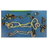 Four stone necklaces, two stone earrings