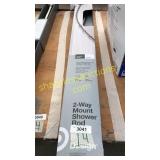 Expandable curved shower rod