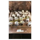 Norman Rockwell decorated mugs and bells