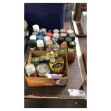 Boxes of spray paint and stain