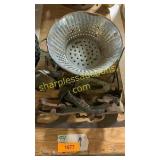 Vintage ice skates, colander
