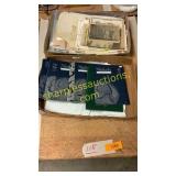 empty coin holders, newspapers, photos