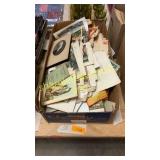 Box of old advertising, newspapers