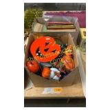 Box of Halloween decorations, books