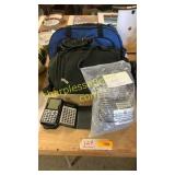 Fire pit rocks, calculator, bags