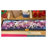 Keep it real sign with hooks