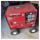 Honda EX3300 portable generator with cover