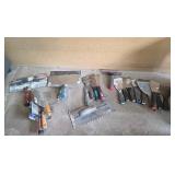 paint tools, scrapers, and trowels in crate