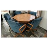 WOOD KITCHEN TABLE W/ FIVE PADDED ROLLING CHAIRS