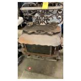 WOOD BURNING STOVE W/ ORNATE CASTIRON UPPER SHELF