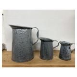 Graniteware Pitchers. Biggest is One Gallon.