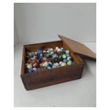 Wooden Box Filled with Glass Marbles.