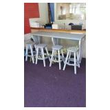 Outdoor bar height table with 4 stools. Outdoor bar height table with 4 stools.
