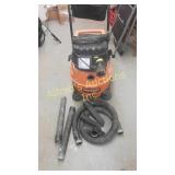 Ridgid shop vac with hose nozzles and extensions.