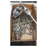Collection of dies and a large tap wrench. Collection of dies and a large tap wrench.