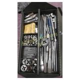 Tool box filled with tap and dies.