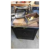 Vintage singer treadle sewing machine in a small Vintage singer treadle sewing machine in a small