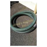 Hard hose suction line.