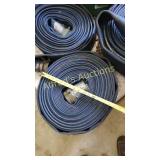 Roll of blue flat hose with couplers