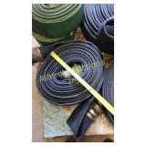 Roll a blue flat hose with couplers. Roll a blue flat hose with couplers.