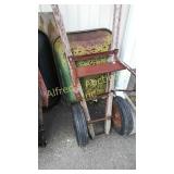 Green Craftsman wheelbarrow. Dual wheels