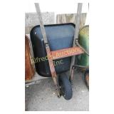 Black True Temper Wheelbarrow With A Poly Tub