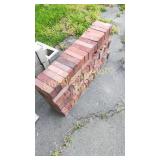 Approximately 70 red bricks sold together in a Approximately 70 red bricks sold together in a