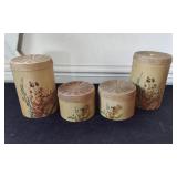 4 Floral Design Canisters on Woodgrain Background