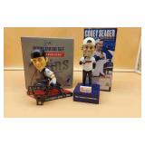 Two Bobble Head Dolls.